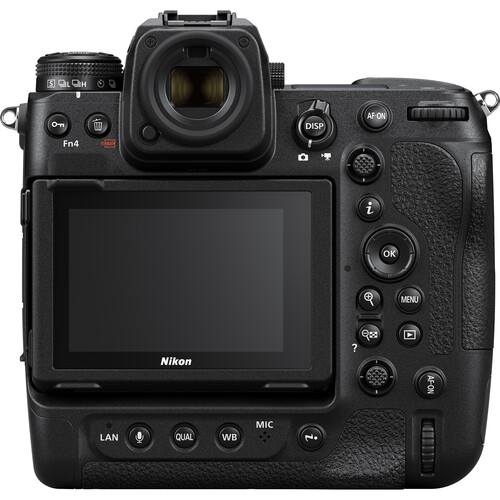 A high-end Nikon Z9 mirrorless camera with a robust build, featuring a large lens, electronic viewfinder, and a sleek black design, positioned on a flat surface.