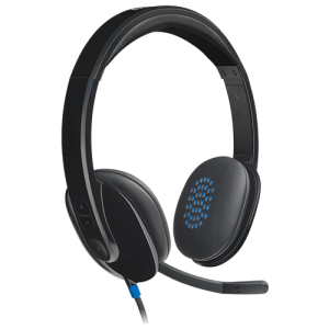 A sleek black Logitech® H540 USB Computer Headset with padded ear cushions, an adjustable headband, and a noise-canceling microphone, resting on a desk with a USB cable connected.