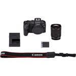 Canon EOS RP full-frame mirrorless camera with RF 24-105mm f/4-7.1 IS STM lens, displayed on a table with accessories.
