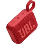 A compact red JBL Go 4 portable Bluetooth speaker with a fabric-covered design, rubberized edges, and a built-in carrying loop, resting on a flat surface.