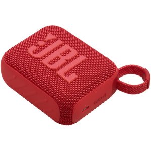 A compact red JBL Go 4 portable Bluetooth speaker with a fabric-covered design, rubberized edges, and a built-in carrying loop, resting on a flat surface.