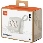 A compact red JBL Go 4 portable Bluetooth speaker with a fabric-covered design, rubberized edges, and a built-in carrying loop, resting on a flat surface.