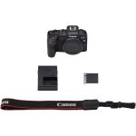 Canon EOS RP full-frame mirrorless camera with RF 24-105mm f/4-7.1 IS STM lens, displayed on a table with accessories.