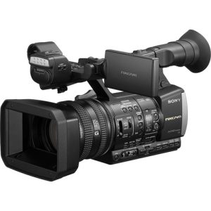 Sony HXR-NX3 NXCAM professional handheld camcorder with a 1/2.8-inch Exmor CMOS sensor, 20x optical zoom, and 3.5-inch LCD screen, ideal for broadcast and documentary filming.