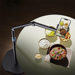 Phone Holder Stand 360 Rotatable Flexible Base clamped to a desk at Camera Stuff Kenya.