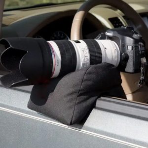 SafariSack bean bag for wildlife photography supporting a DSLR camera on a car door in Kenya